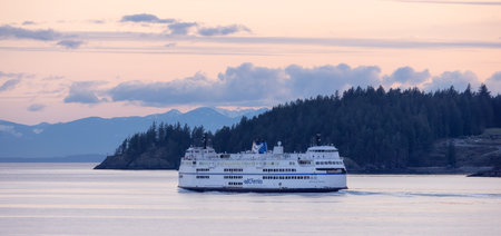West Vancouver, British Columbia, Canada - April 14, 2023: BC Ferries leaving the Horseshoe Bay Terminal in Howe Sound during colorful Sunset.のeditorial素材