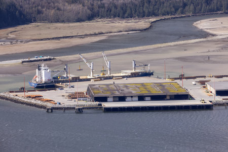 Squamish, British Columbia, Canada - April 24, 2023: Aerial View of Industrial Site and Port on Pacific Ocean in Howe Sound.のeditorial素材