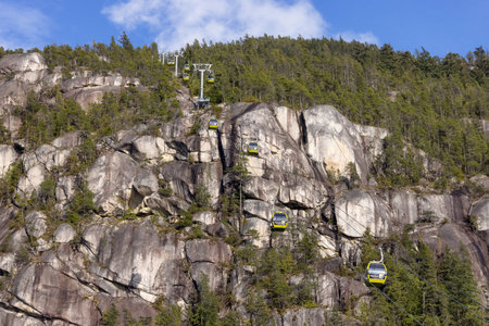 Squamish, British Columbia, Canada - April 24, 2023: Sea to Sky Gondola going up the mountain during sunny spring season day.のeditorial素材