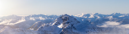 Snow Covered Mountain Tops in Canadian Nature Landscape. Aerial Panorama. Near Vancouver, British Columbia, Canada.の写真素材