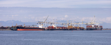 Tsawwassen, BC, Canada - May 19, 2023: Container Ship at the Port being loaded for shipment.のeditorial素材