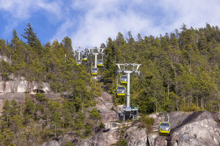 Squamish, British Columbia, Canada - April 24, 2023: Sea to Sky Gondola going up the mountain during sunny spring season day.のeditorial素材