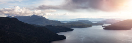Aerial Panoramic View of Islands and Ocean Inlet near Sunshine Coast, British Columbia, Canada. Cloudy Sunset Sky. Nature Background Panoramaの写真素材