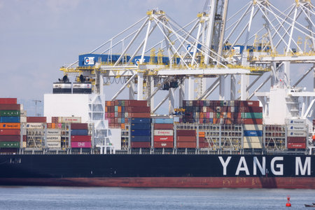 Tsawwassen, BC, Canada - May 19, 2023: Container Ship at the Port being loaded for shipment.のeditorial素材
