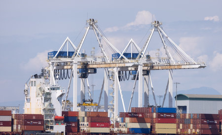 Tsawwassen, BC, Canada - May 19, 2023: Container Ship at the Port being loaded for shipment.のeditorial素材