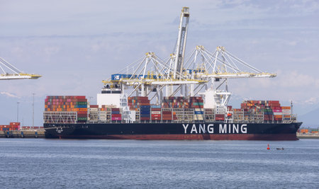 Tsawwassen, BC, Canada - May 19, 2023: Container Ship at the Port being loaded for shipment.のeditorial素材