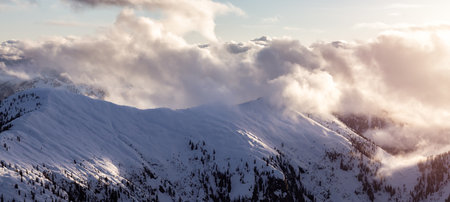 Canadian Coastal Mountain Landscape covered in Clouds. Aerial Panorama. British Columbia, Canada.の写真素材
