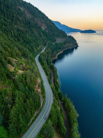 Sea to Sky Highway on Pacific Ocean West Coast. Aerial. Sunny Colorful Sunrise. Located in Howe Sound between Vancouver and Squamish, British Columbia, Canada.の写真素材