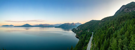 Sea to Sky Highway on Pacific Ocean West Coast. Aerial Panorama. Sunny Colorful Sunrise. Located in Howe Sound between Vancouver and Squamish, British Columbia, Canada.の写真素材