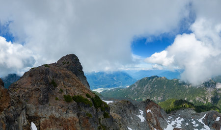 Aerial Panoramic View of Rocky Mountain Landscape. Cloudy Sunny Day. Taken in British Columbia, Canada. Nature Backgroundの写真素材