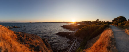 Scenic View of the Coastline on the West Pacific Ocean Coast. Summer Sunset. MacAulay Point Park in Victoria, Vancouver Island, British Columbia, Canada.の写真素材