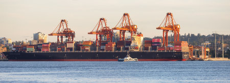 Vancouver, BC, Canada - June 16, 2023: Ship, Containers and Cranes in Port of Vancouver and City in Background.のeditorial素材