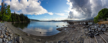 Wooden pier at the Pacific Ocean Coast in City park. Belcarra, Vancouver, BC, Canada.の写真素材