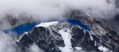 Rocky Mountain Peak and Glacier Lake. Aerial Landscape Nature Background. View from Airplane, Washington, USA.の写真素材