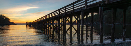 Wooden Quay at Rocky shore on Pacific Ocean West Coast. Washington, USA. Nature Background. Sunsetの写真素材