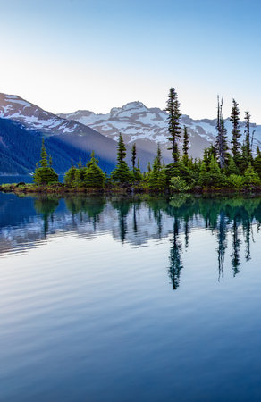 Glacier Lake with trees and Canadian Mountain Landscape. Garibaldi Lake, Whistler, British Columbia, Canada.の写真素材