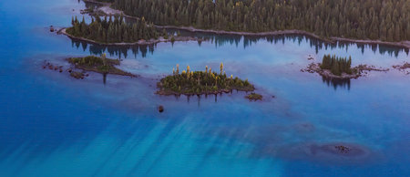 Aerial View of Rocky Islands and Green Trees on Glacier Lake. Garibaldi, Whistler, British Columbia,...