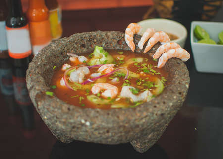 Soup shrimp with vegetables, avocado in molcajete, aguachileの写真素材