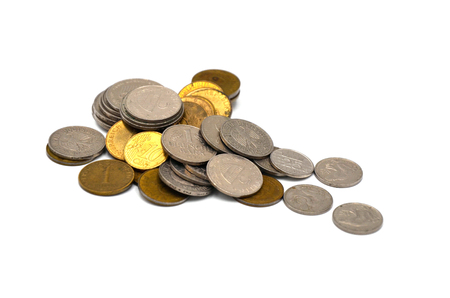 coins in different currency on a white backgroundの写真素材