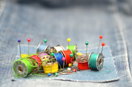 sewing kit on a blue jean template