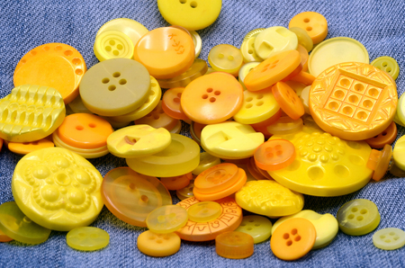 buttons yellow close up on jean templateの写真素材