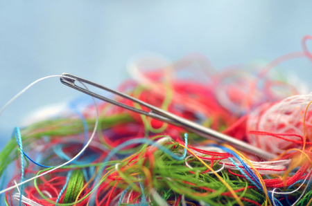 yarn in many colors and pin on jeanの写真素材