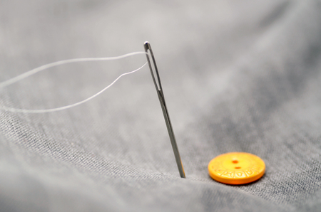 pin and button close up on a jeanの写真素材