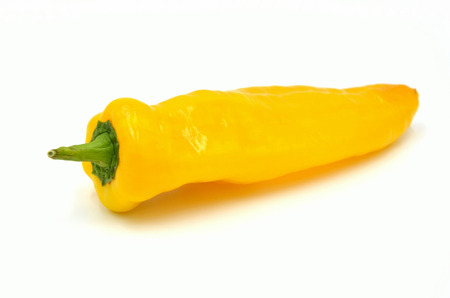 pointed paprika yellow on white background photo