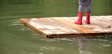 child on a float of a seaの写真素材