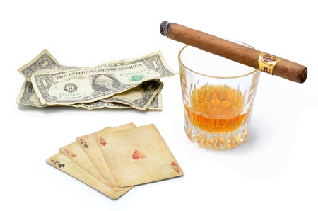 Money Poker Whiskey drink on a white backgroundの写真素材