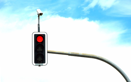 Traffic light with clouds in the backgroundの写真素材