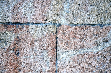 Stone wall near position red white colorの写真素材