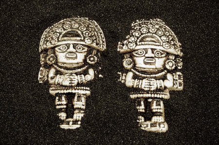 Statue wood on a black sand close upの写真素材