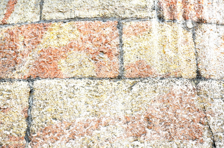 Stone wall near position red white colorの写真素材