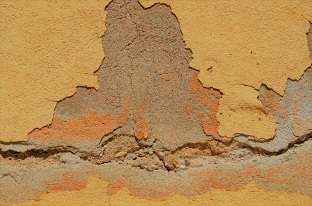 Stone wall near position brown yellow colorの写真素材