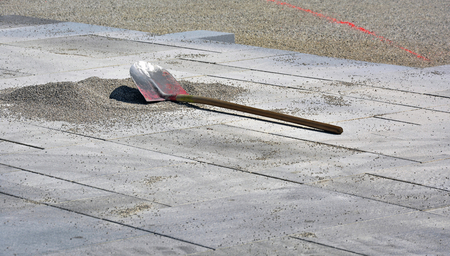 Shovel on the ground of a buidling siteの写真素材