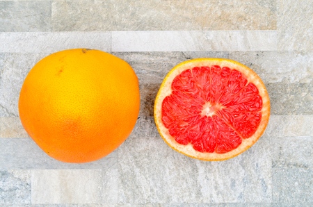 grapefruit full and a half close up photoの写真素材