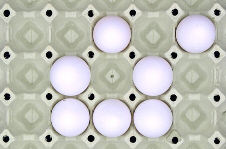 Eggs in cardboard box close up photoの写真素材