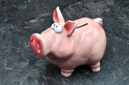 pig moneybox on dark underground close upの写真素材