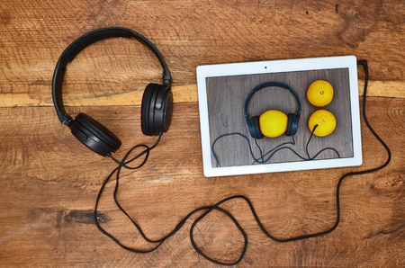 Headphone fun with an orange close up photoの写真素材