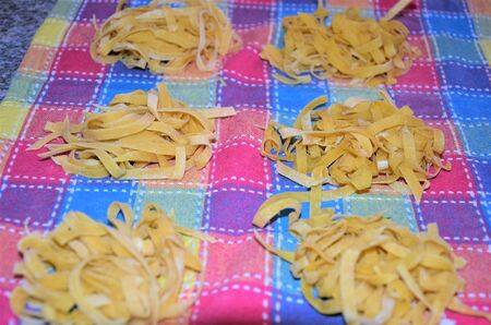 Pasta on a kitchen plaidの写真素材