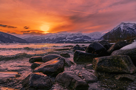 Sunset over the lake with mountains in the background, Switzerland.の写真素材