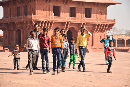 Group of indian kids walking inside Fatehpur Sikri archaeological site, Uttar Pradesh, Indiaのeditorial素材