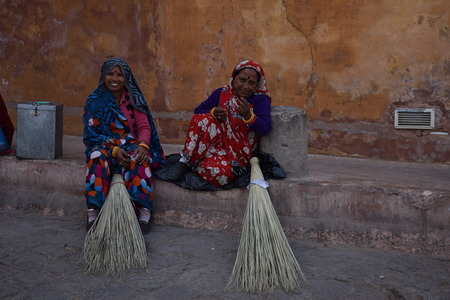 Indian women with broom outside Amber Fort in Jaipur, Rajasthan, Indiaのeditorial素材