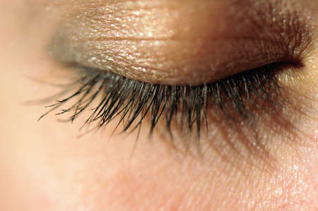 Close-up of closed eye with long eyelashes macro