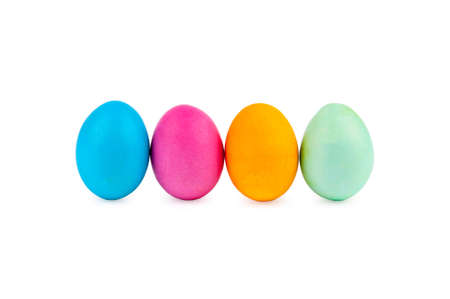 Standing colorful Easter eggs at line with shadows on white backgroundの写真素材