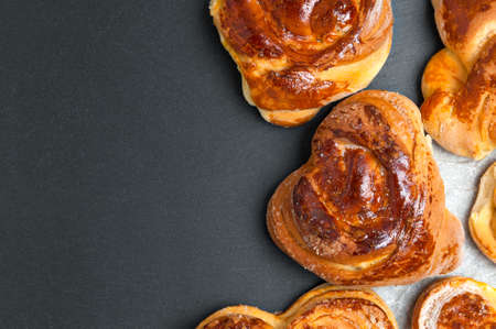 Homemade buns on black slateの写真素材