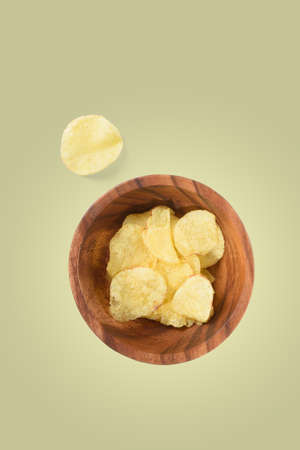 Top view of bowl with potato chips isolatedの写真素材