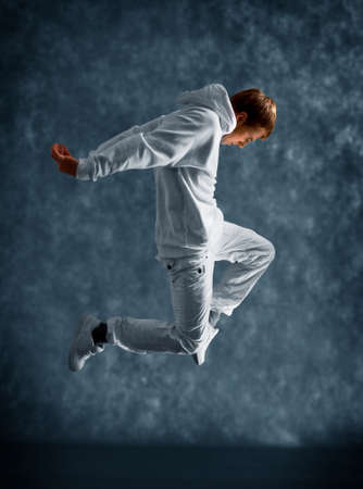 modern dancer poses in front of the old dirty wall
の写真素材