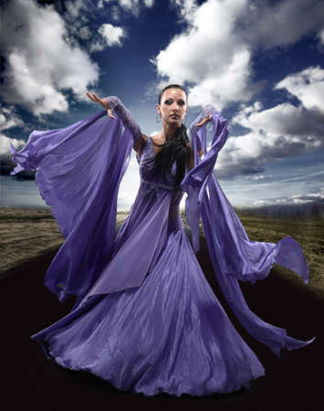 Beautiful dancer wearing blue dressの写真素材